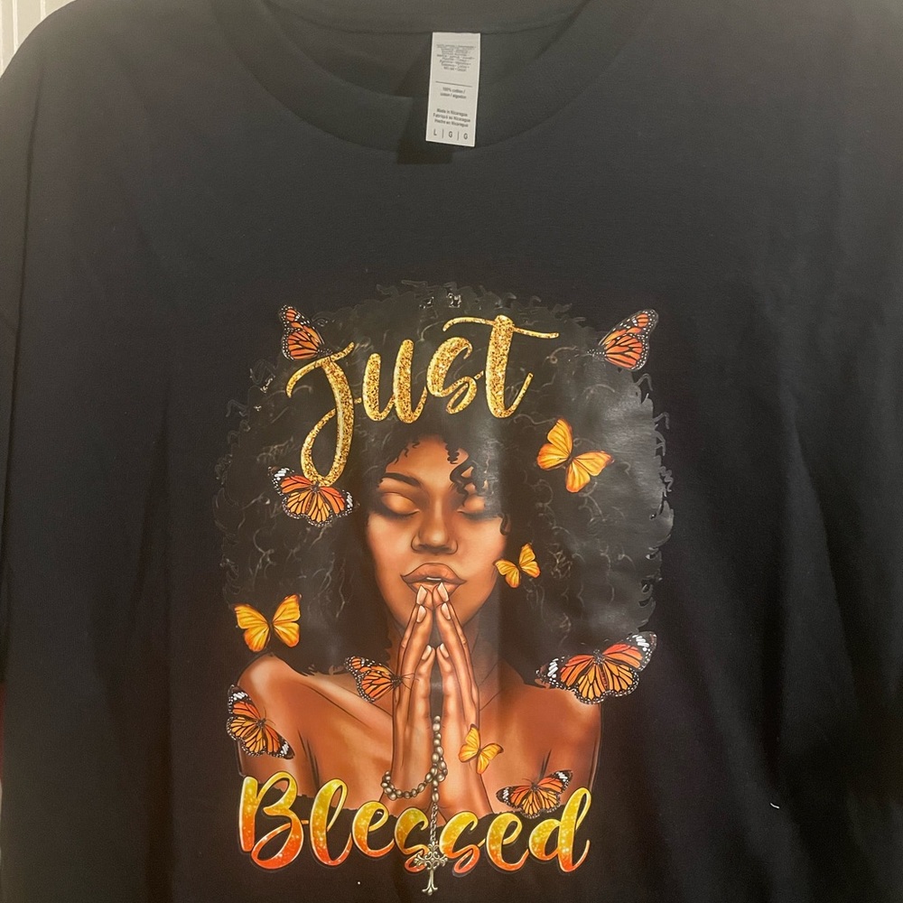 A Large black “just blessed t shirt” with beautiful coloring.